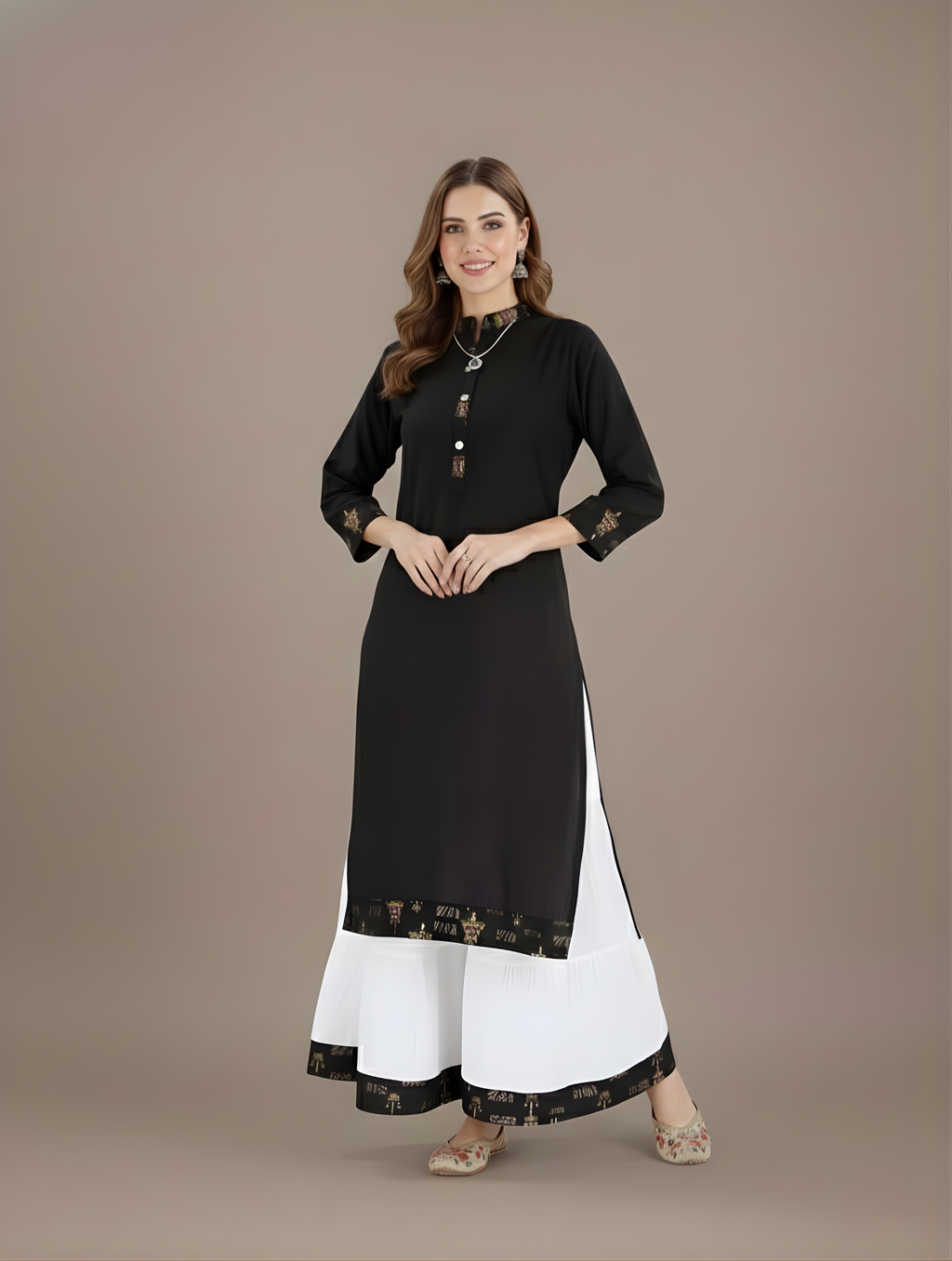 Woman wearing a black and white outfit on a brown background
