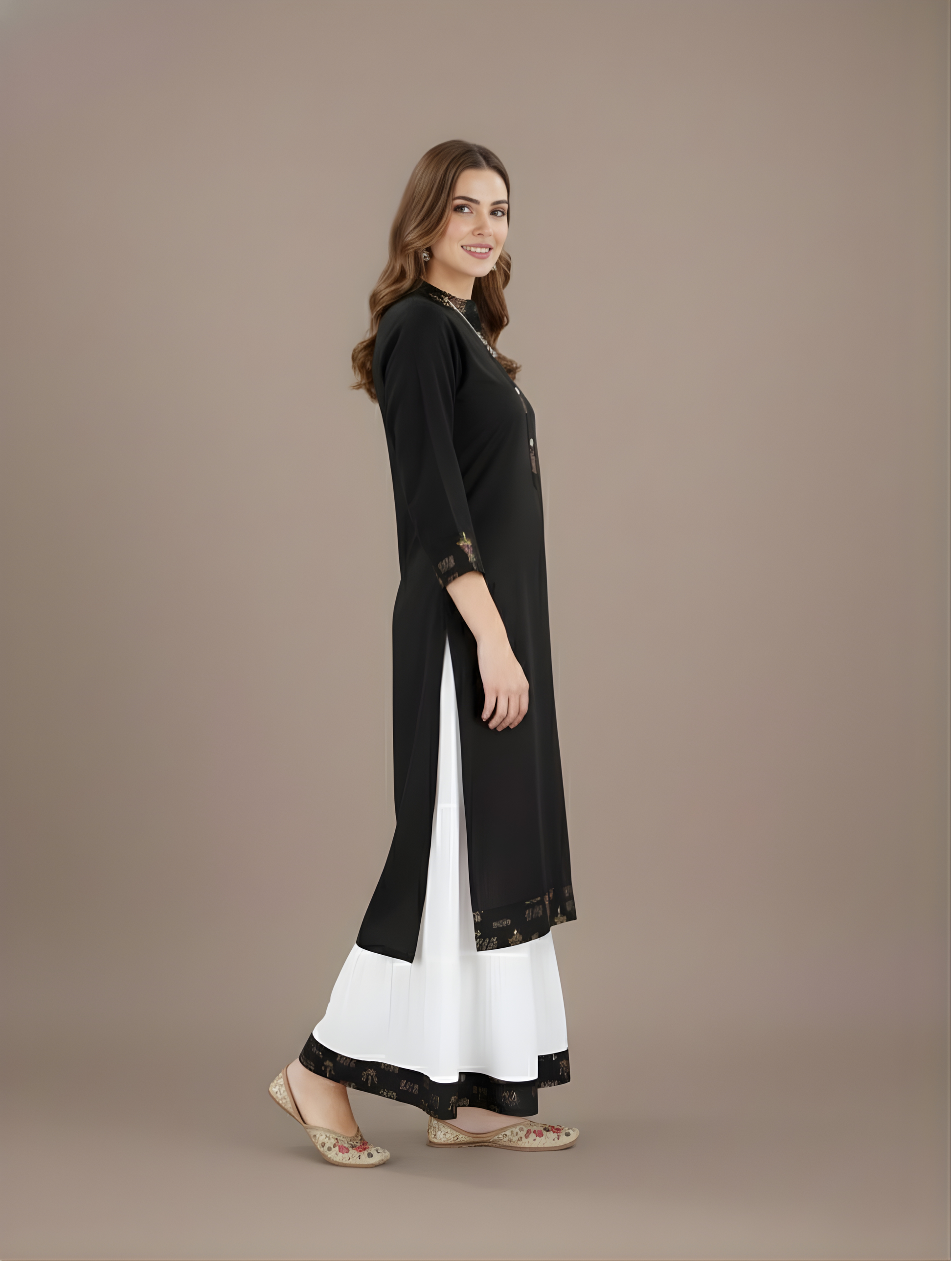 Woman wearing a black and white outfit on a brown background