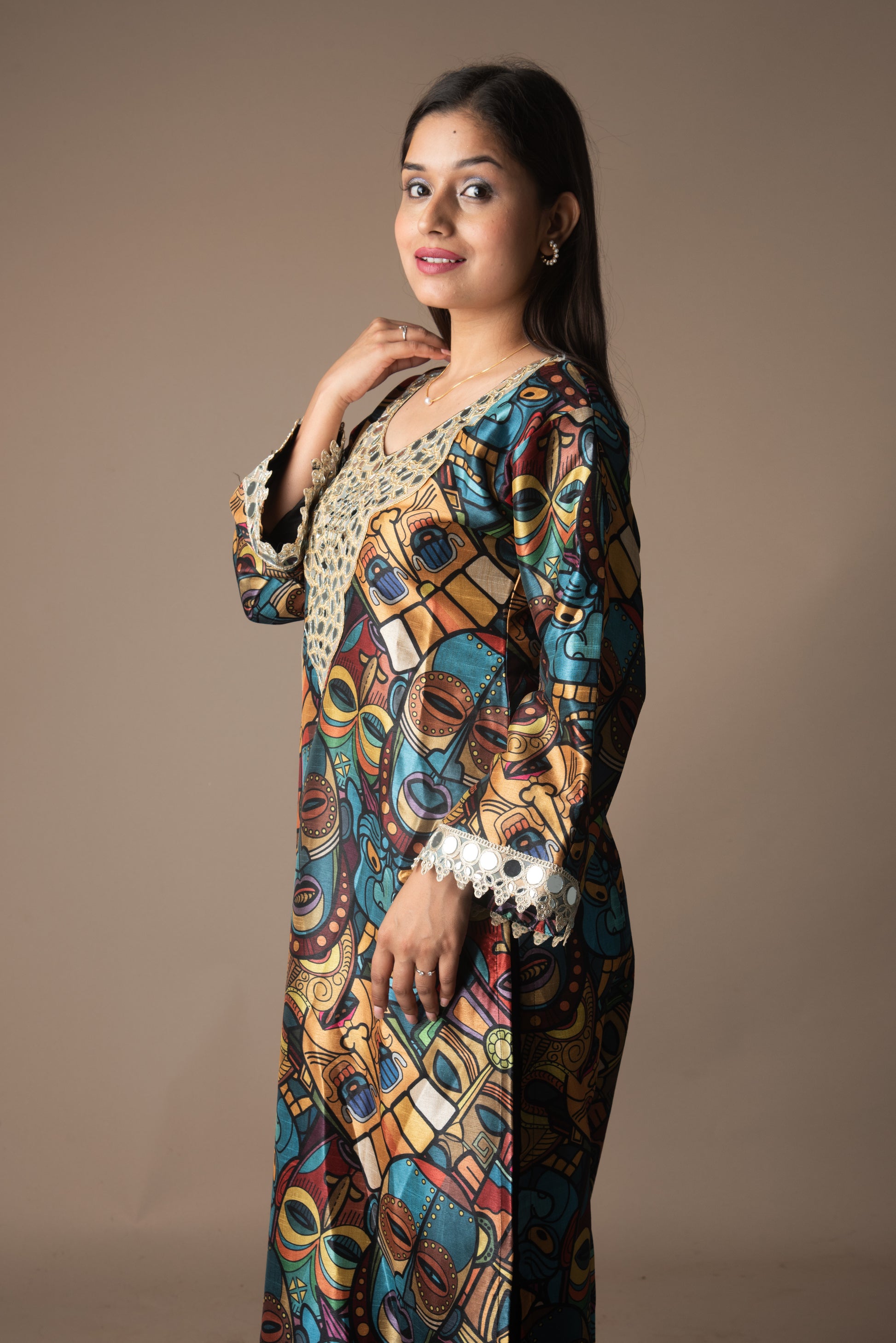 Woman wearing a colorful patterned outfit against a brown background