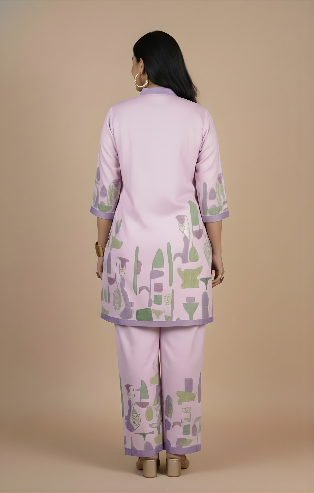 Woman wearing a light purple outfit with green and gray patterns on a beige background